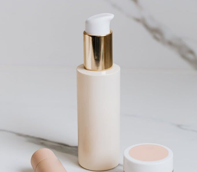 Assorted Cosmetics on White Surface